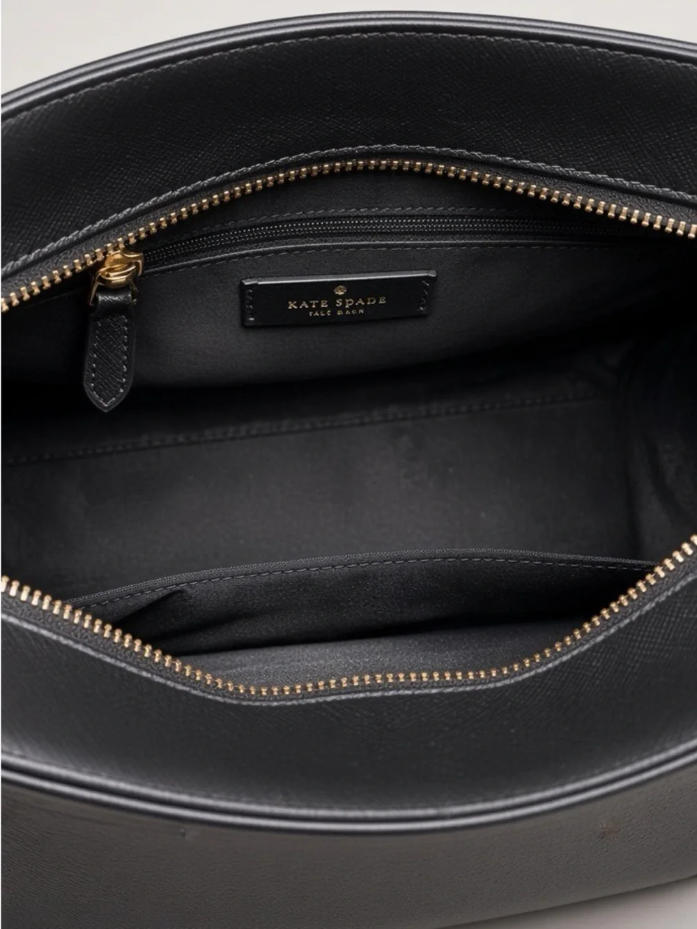 Kate Spade New York black saffiano leather satchel.